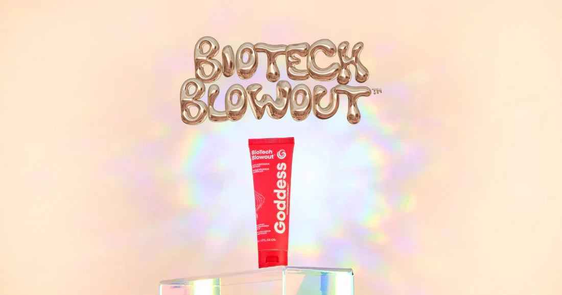 Goddess Maintenance Co. BioTech Blowout Leave-In Restorative Hair Mask tube showcased on a holographic display with rainbow reflections.