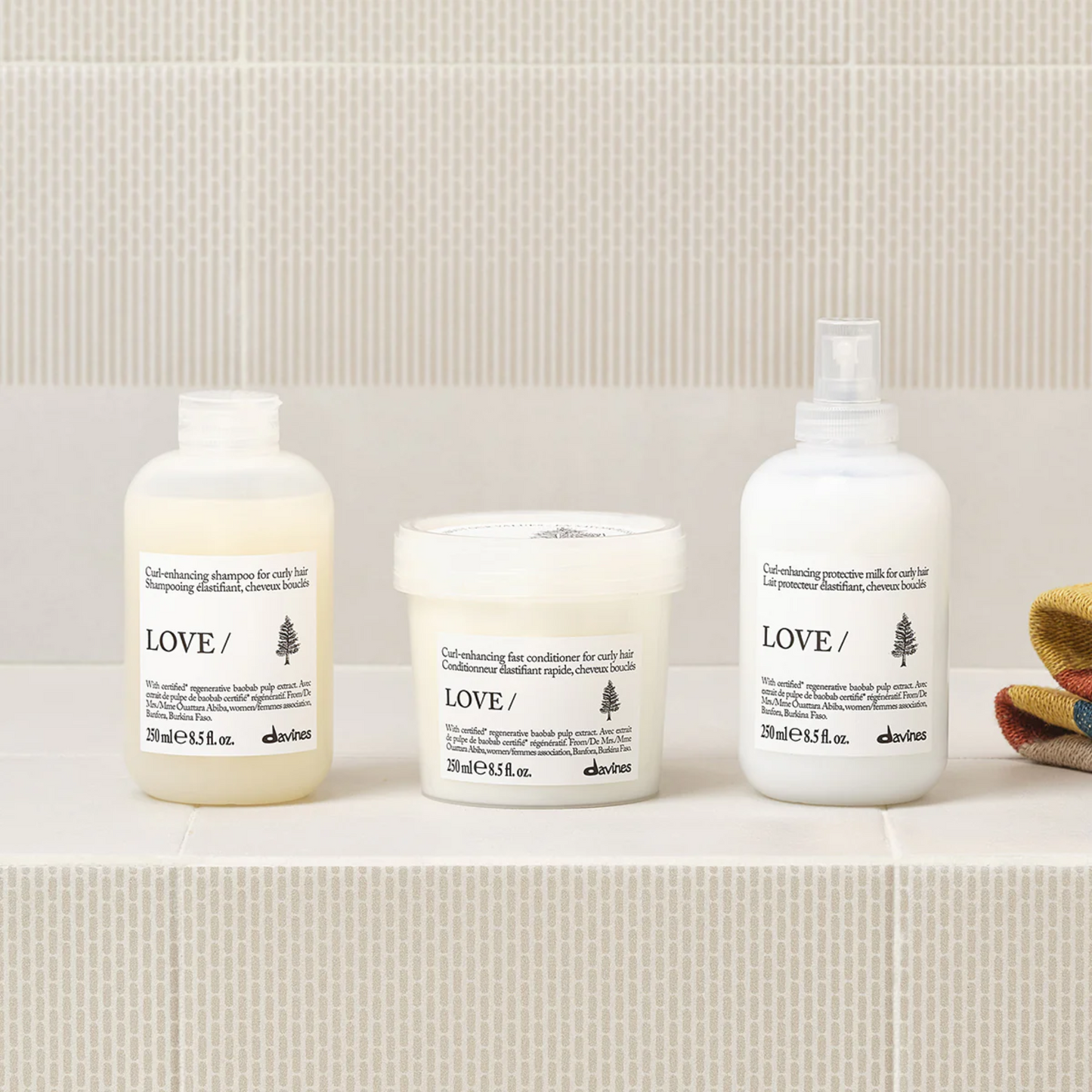 Davines LOVE CURL shampoo conditioner and enhancing milk system for defining curls reducing frizz and adding softness