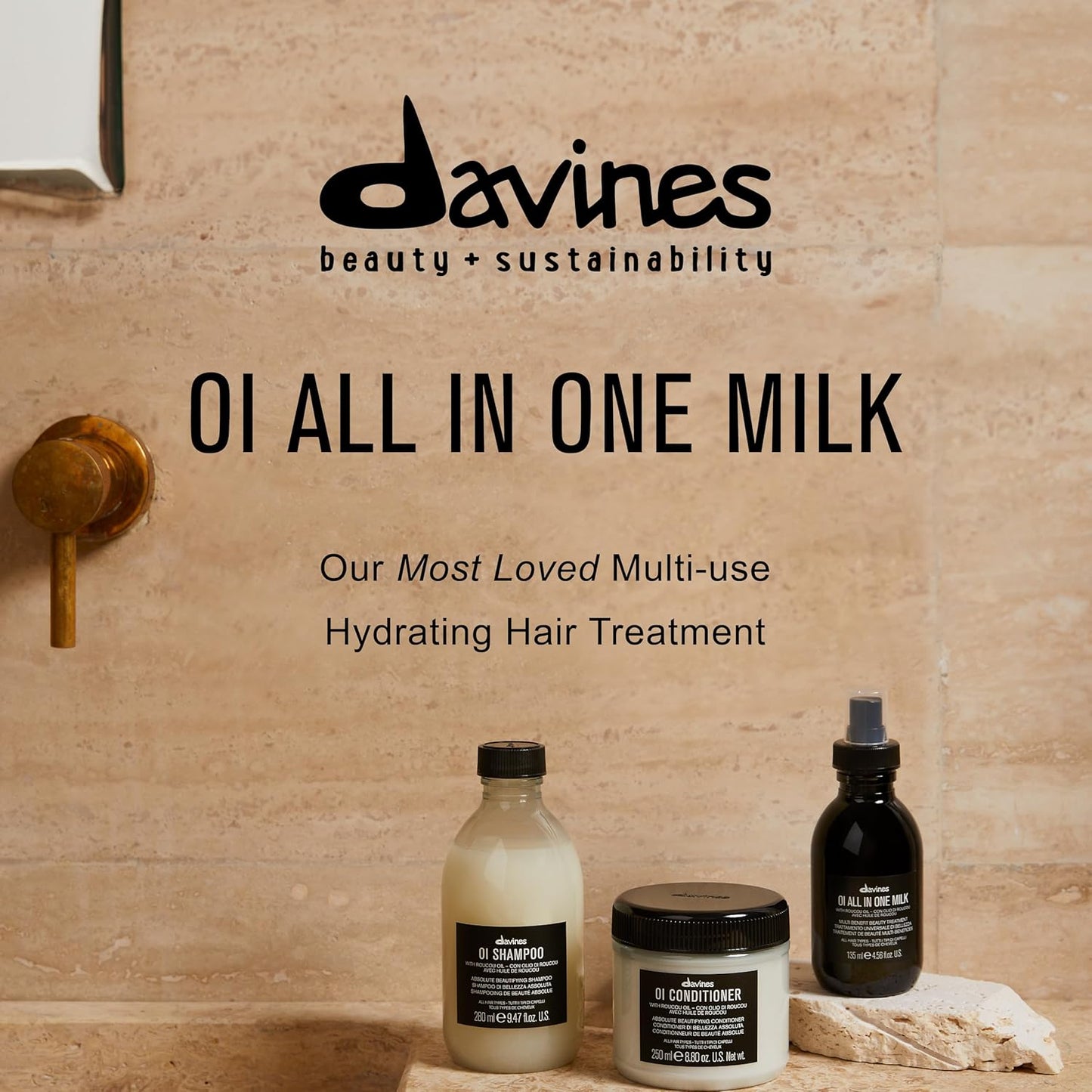 Davines OI All in One Milk hair care products on a bathroom counter with a beige wall background.