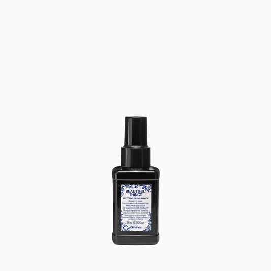 Black bottle with a label on a white background