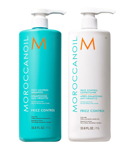 Two bottles of Moroccanoil Frizz Control shampoo and conditioner on a neutral background