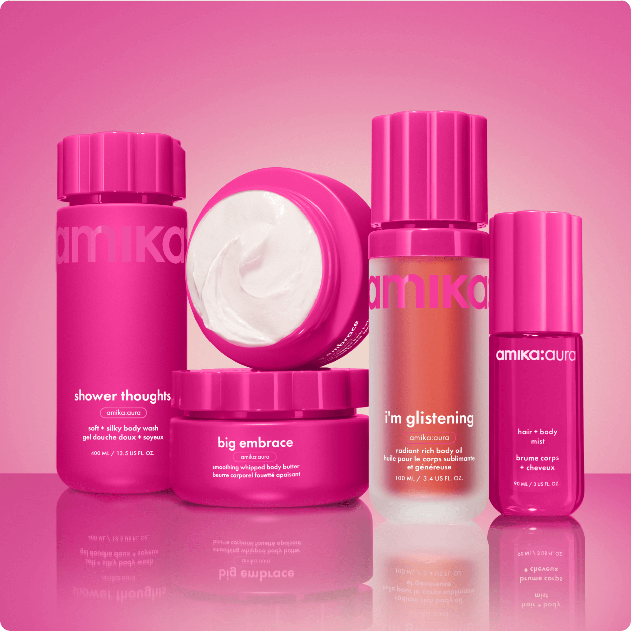 Amika body care collection featuring Shower Thoughts body wash, Big Embrace whipped body butter, aura hair and body mist, and I'm Glistening radiant body oil