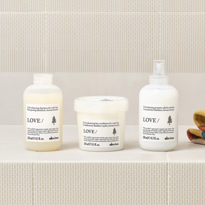 Davines LOVE CURL shampoo conditioner and enhancing milk system for defining curls reducing frizz and adding softness