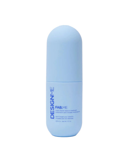 A light blue cylindrical cosmetic bottle with a rounded cap, featuring the brand name 'DESIGNME' and product line 'FAB·ME' printed vertically on the front, set against a clean white background.