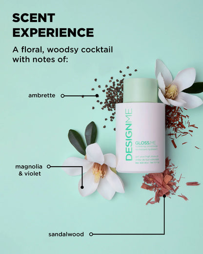A bottle of DESIGNME Gloss Me hair conditioner is displayed on a mint green background with graphic callouts pointing to scent notes: ambrette, magnolia & violet, and sandalwood, alongside botanical illustrations.