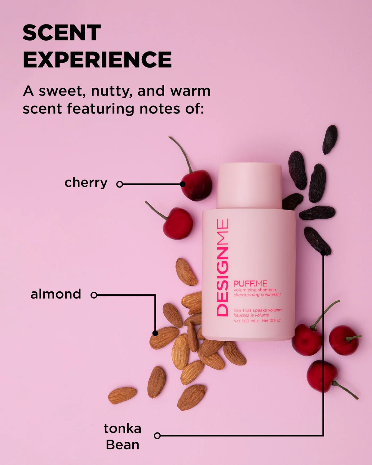 Product bottle with cherry, almond, and tonka bean elements on a pink background