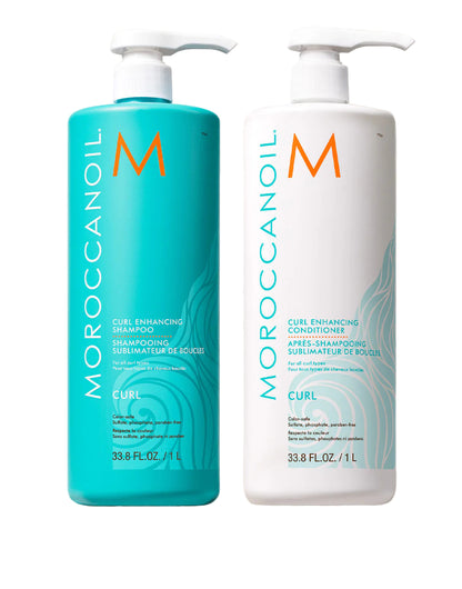 Two bottles of Moroccanoil Curl Enhancing Shampoo and Conditioner on a light background