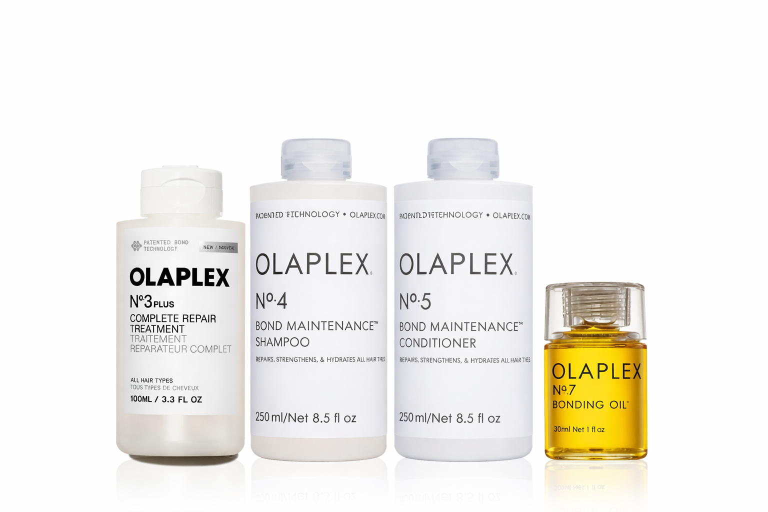 Olaplex No.3 Plus Complete Repair Treatment, No.4 Bond Maintenance Shampoo, No.5 Conditioner, and No.7 Bonding Oil haircare set on white background