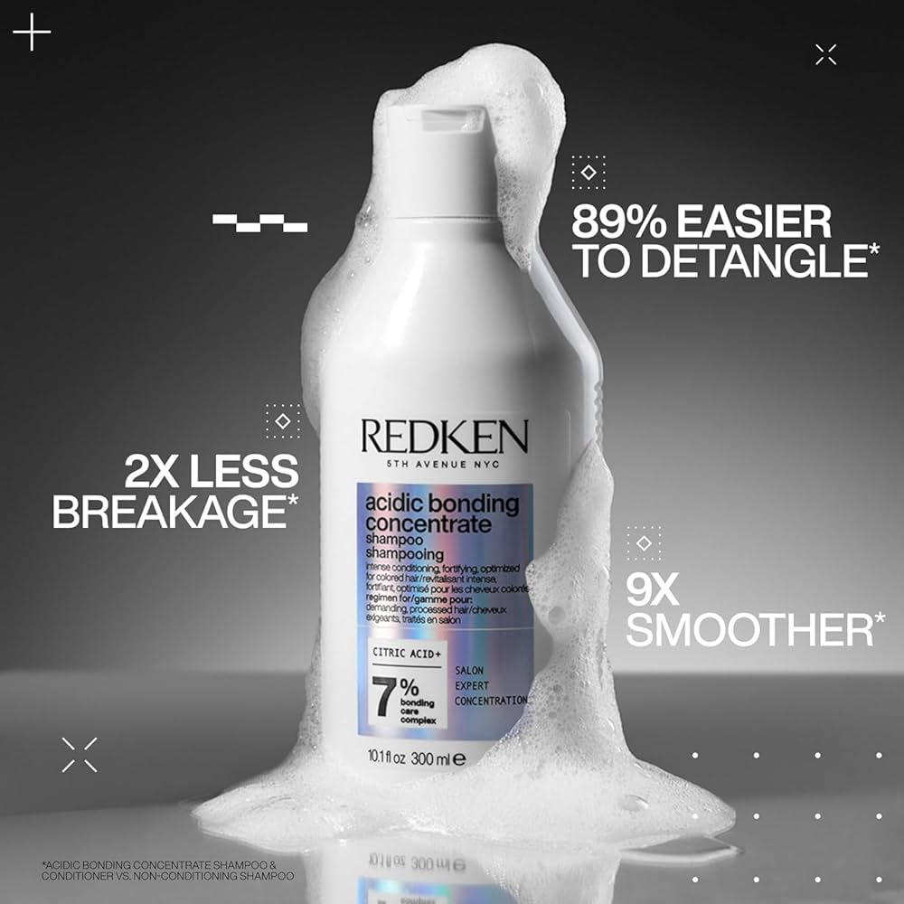 Redken Acidic Bonding Concentrate Shampoo bottle close-up for damaged hair repair and strengthening